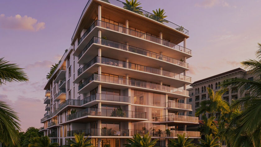 Sunset exterior of Glass House Boca Raton surrounded by palm trees and glowing architecture